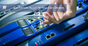 Hand connecting a cable to a Cisco device for console access.