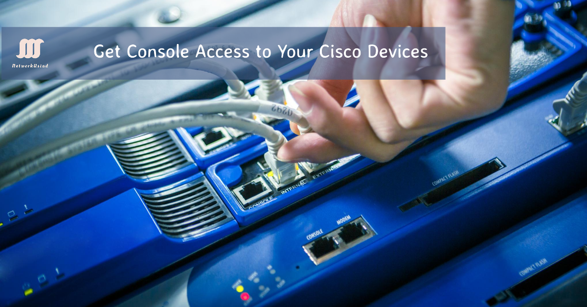 Hand connecting a cable to a Cisco device for console access.
