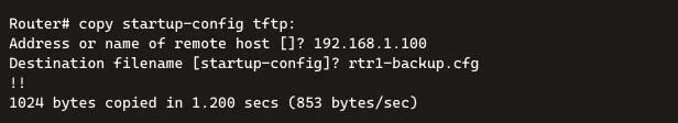 A terminal screenshot showing the execution of the "copy startup-config tftp:" command on a router. The output includes the prompt for the remote host address, entered as 192.168.1.100, and the destination filename, set to rtr1-backup.cfg (defaulting to startup-config). The process successfully copied 1024 bytes in 1.200 seconds at a rate of 853 bytes/second.