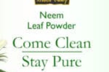 Packaging of Bio Organic Neem Leaf Powder with a bowl of neem leaves and a woman applying the product to her face.