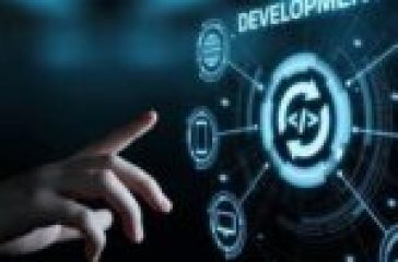 A hand reaching towards a futuristic interface displaying web development icons and a central coding symbol.