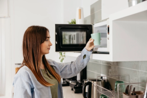 A modern microwave oven with a sleek design on a kitchen countertop.