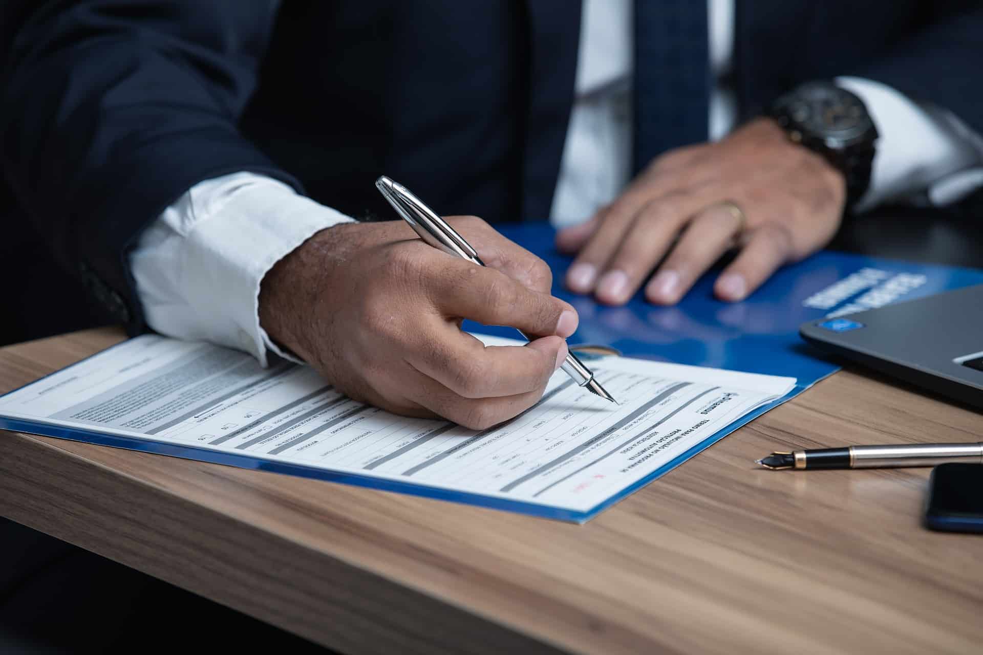 A professional injury lawyer consulting with a client in their office, highlighting the importance of choosing the right legal representation.