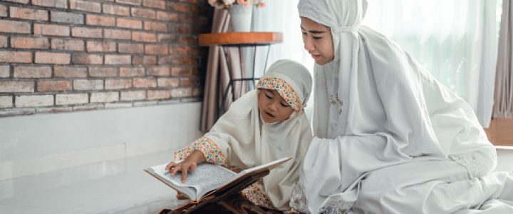 mother and kid reading quran together at home Quran