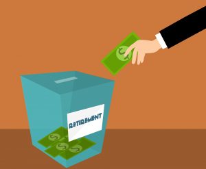 A person holding a piggy bank, symbolizing saving money for retirement.