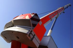 Construction workers wearing safety gear and following safety protocols on a construction site.