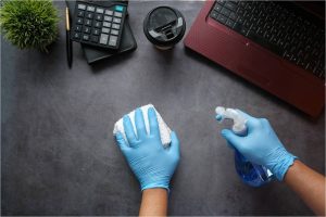 A gloved hand holding a labeled ‘Paternity Test’ tube with a red sample inside against a white background.