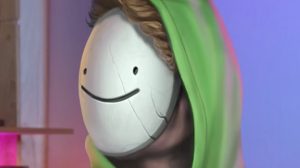 Person with blond hair wearing a plain white smiling mask and green hood against a blurred purple and pink background.