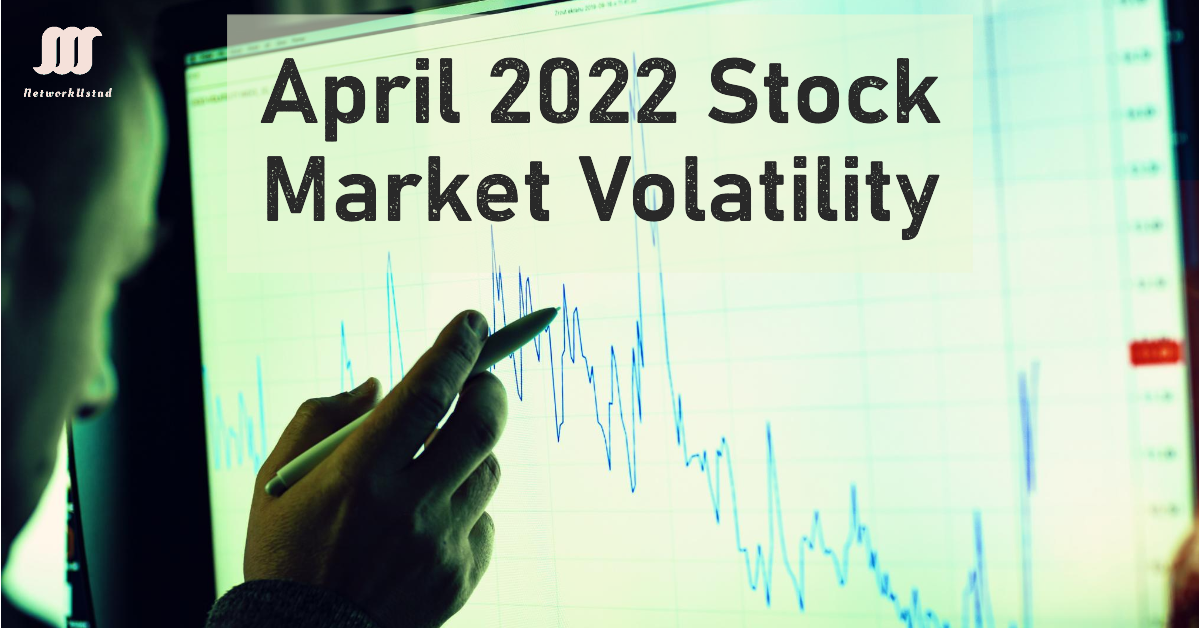 A person analyzing stock market data on a screen with the text "April 2022 Stock Market Volatility.