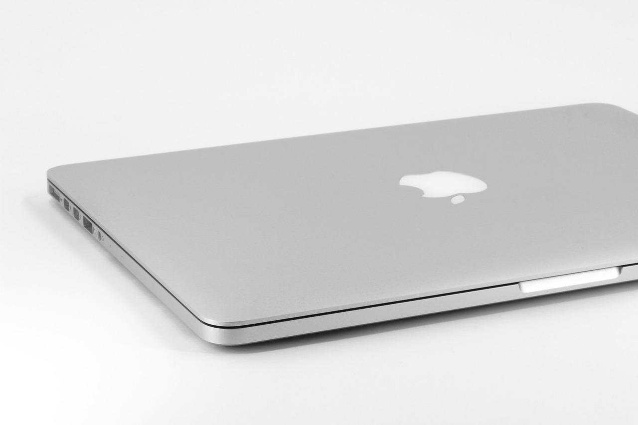 A closed MacBook on a white background, showcasing its sleek design and Apple logo. #Apple iMac Pro i7