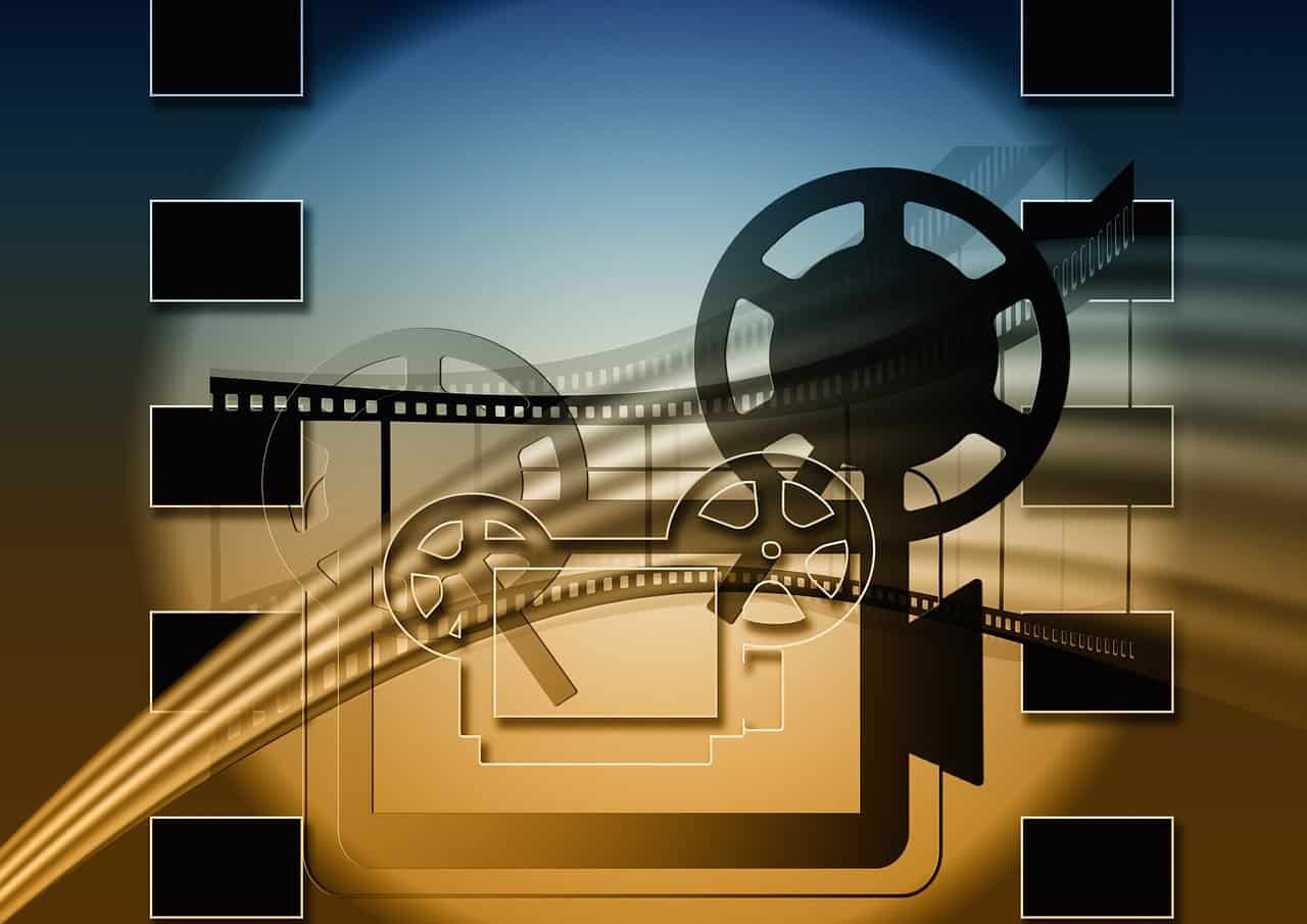 Hubflix: Stylized representation of cinema evolution from film reels to digital pixels.