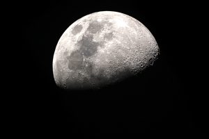 A detailed photograph of a waxing gibbous moon against a dark background, showcasing craters and surface variations. #Lunar Phase