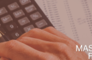 A hand holding a pen over a calculator with financial documents underneath, indicating preparation for mastering finance assignments.
