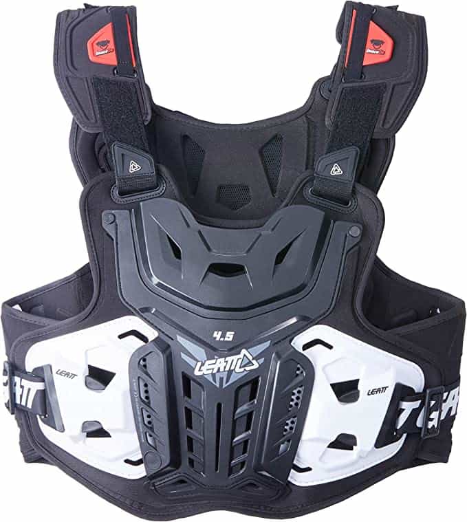 A black and white motocross chest protector with shoulder guards The protector features a prominent central chest plate with angular designs flanked by adjustable shoulder pads with red detailing The brand Leatt is visible on the lower front part and the model 45 is indicated on the side rib area The design suggests robust protection for motorcycling sports 🏍️🛡️