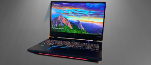 Acer Predator Helios 500 gaming laptop open on a desk displaying vibrant mountain wallpaper. #Acer Predator Helios 500 17 AMD
