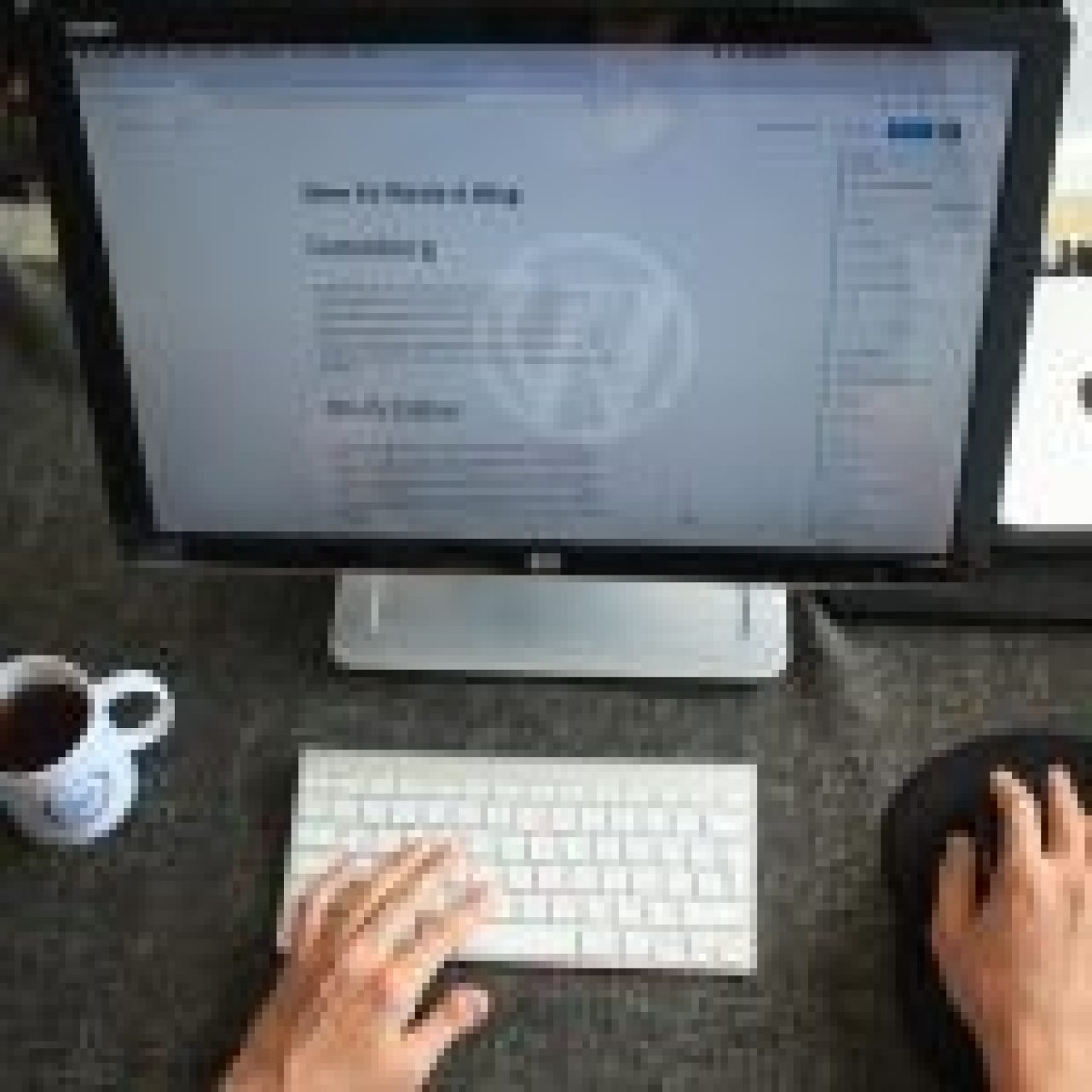 A person working on a blog post about writing blogs on a computer with WordPress open, indicating content creation for guest blogging.