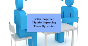 Two stylized figures seated at a table with a presentation board that reads “Better Together: Tips for Improving Team Dynamics.