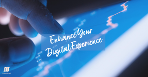 A person’s finger tapping on a tablet screen that displays dynamic line graphs with ‘Enhance Your Digital Experience’ written across.