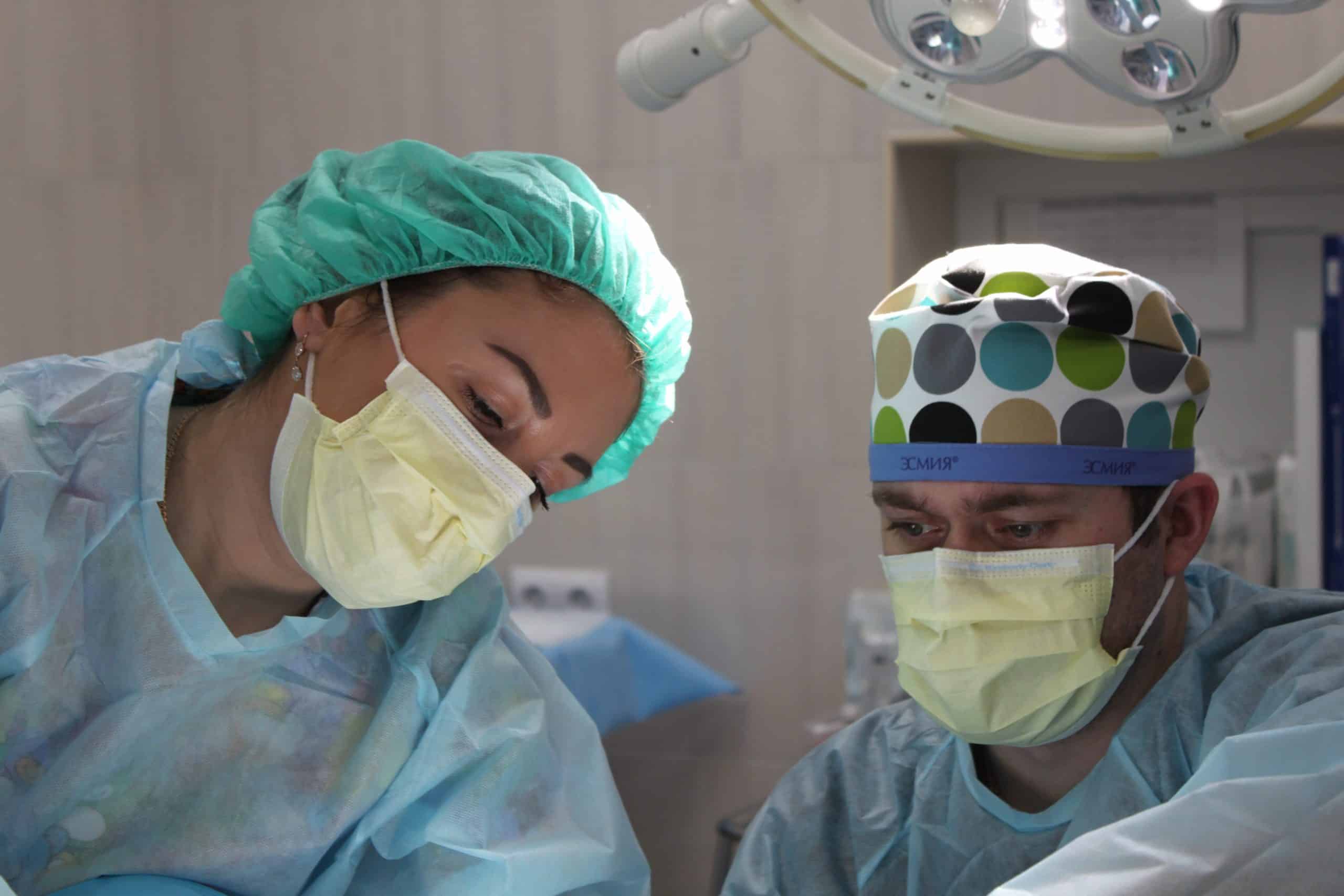 Surgeon performing a brow lift surgery in an operating room