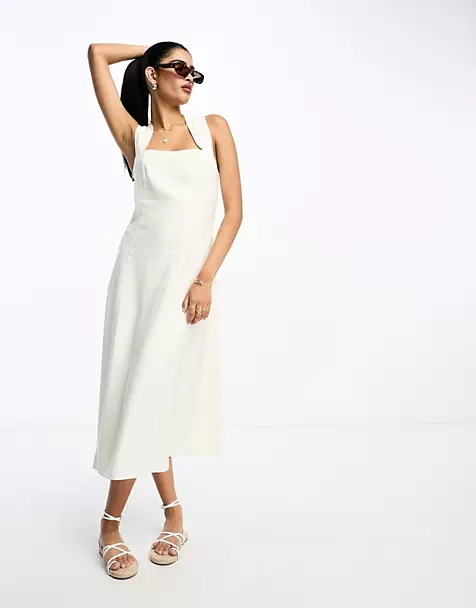 Embracing Elegance: The Timeless Allure of the White Midi Dress