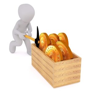 A figure mining Bitcoins from a wooden crate to represent cryptocurrency mining.