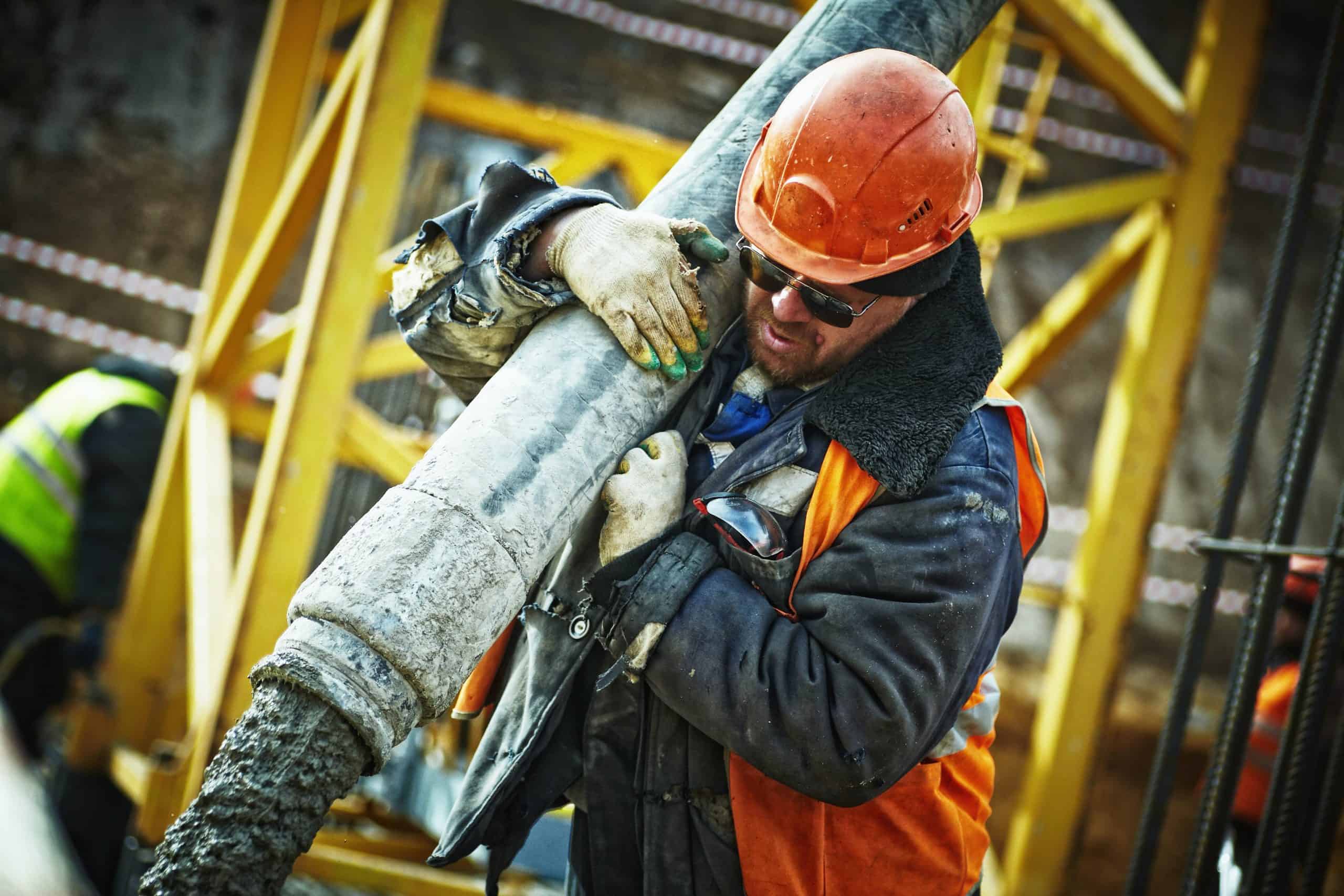 Image showing construction site with workers and highlighting potential hazards contributing to accidents.