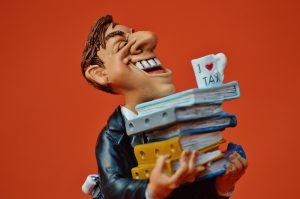 Illustration of tax concepts: books, calculator, and financial documents.