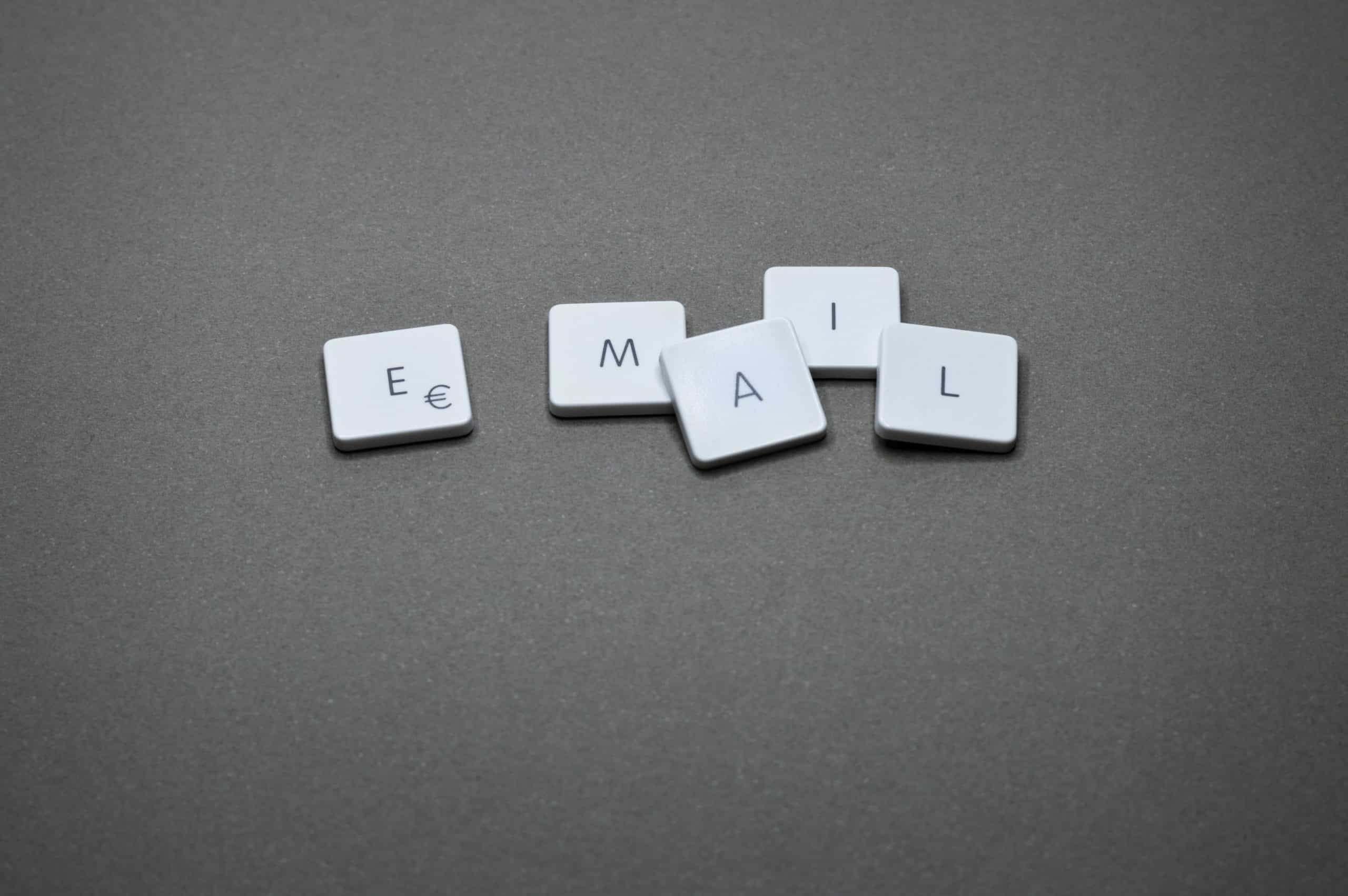 White letter tiles on a dark grey background spelling out ‘EMAIL