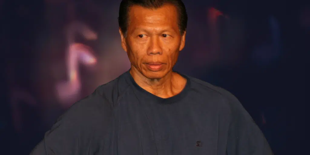 Close up image of Bolo Yeung showcasing his intense gaze and strong facial features symbolizing his prominent role in martial arts cinema