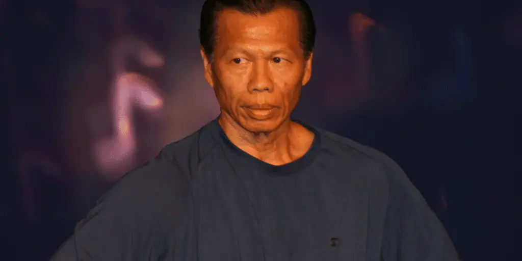 Close-up image of Bolo Yeung, showcasing his intense gaze and strong facial features, symbolizing his prominent role in martial arts cinema.