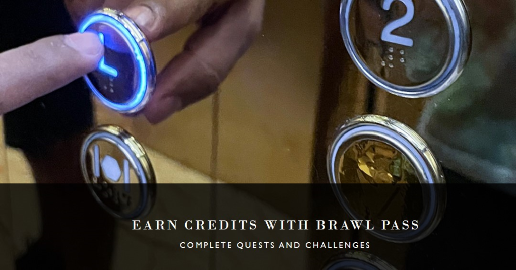 The image shows a close-up of a hand pressing an illuminated elevator button with the number 2 on it. Below this, there’s text that reads “EARN CREDITS WITH BRAWL PASS” and “COMPLETE QUESTS AND CHALLENGES.” It seems to be an advertisement for a rewards system called Brawl Pass, where you can earn credits by completing various activities. The elevator button might symbolize ‘elevating’ your status or progress within the Brawl Pass system.