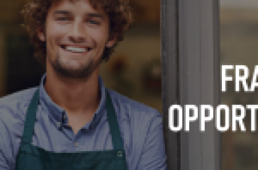 Individual in a green apron standing behind a glass door with text overlay ‘FRANCHISE OPPORTUNITIES AWAIT!’ #Store Industry