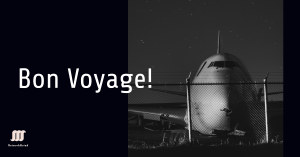 Front view of a retired airplane at night with ‘Bon Voyage!’ text above, symbolizing its final journey.