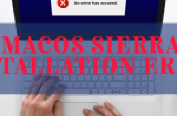 A person’s hands on a keyboard with a laptop screen displaying an error message during macOS Sierra installation.