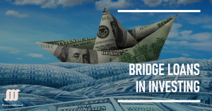 A paper boat made of dollar bills floating on a sea of dollar bills under a blue sky with clouds. The text "BRIDGE LOANS IN INVESTING" is written on the right side of the image.