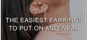 Close-up of a person's ear wearing multiple earrings, with the text "THE EASIEST EARRINGS TO PUT ON AND WEAR" overlaid on the image.