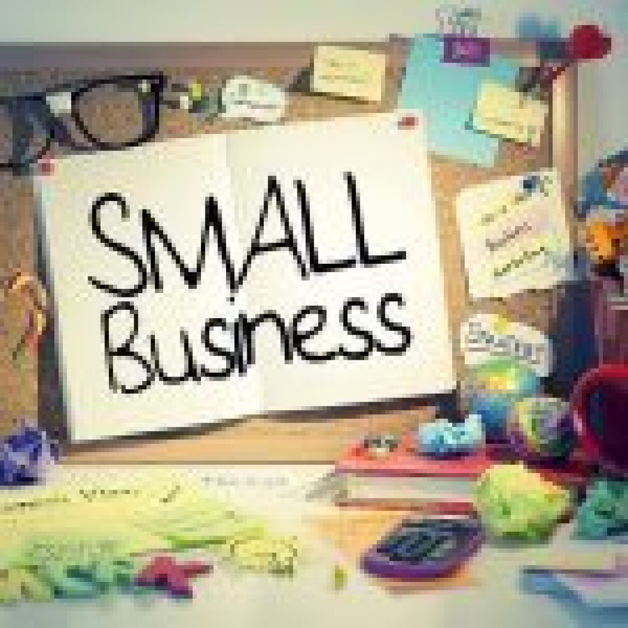 A corkboard with a notebook paper that says "Small Business" on it.