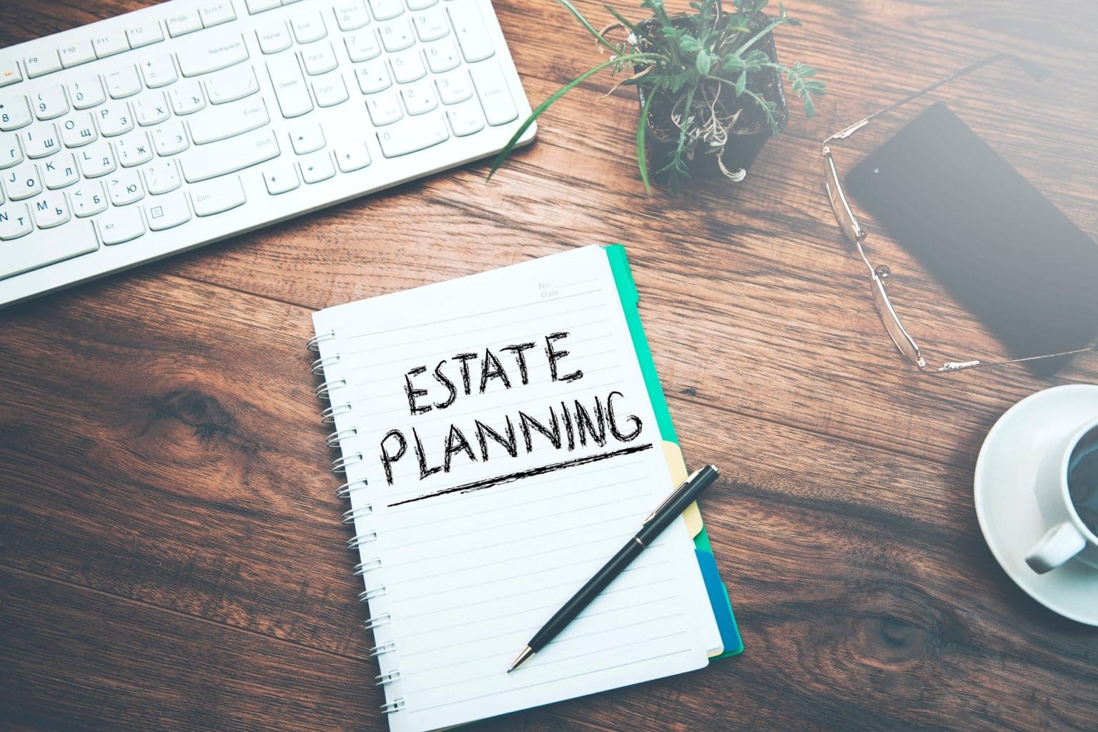 Notebook with the words "Estate Planning" written on it
