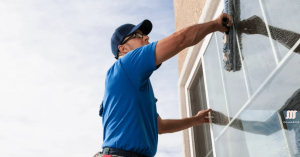 Professional window cleaning service maintaining window tint quality.