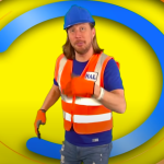 Handyman Hal Net Worth: Handyman Hal Holding A Drill, Smiling In A Workshop Filled With Tools And Diy Projects.
