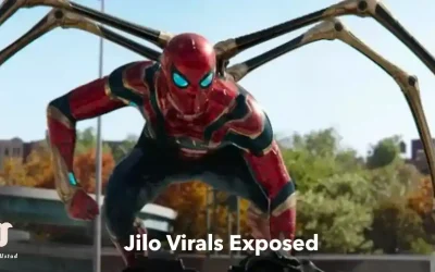 Spider-Man in his Iron Spider suit with mechanical arms extended, crouching in an urban setting.