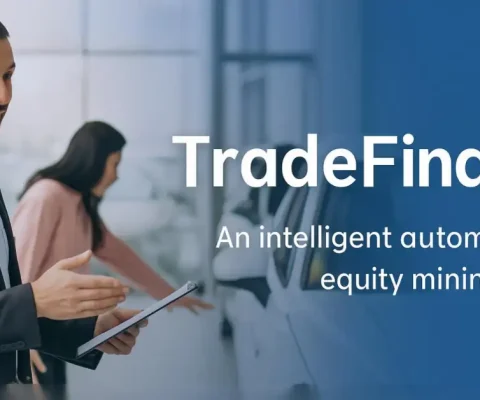 Car Dealership Sales Professional Holding Tablet Explaining Tradefinder Equity Mining Tool To Customer In Showroom