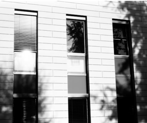 Modern White Brick Building With Architectural Window Films And Privacy Treatments