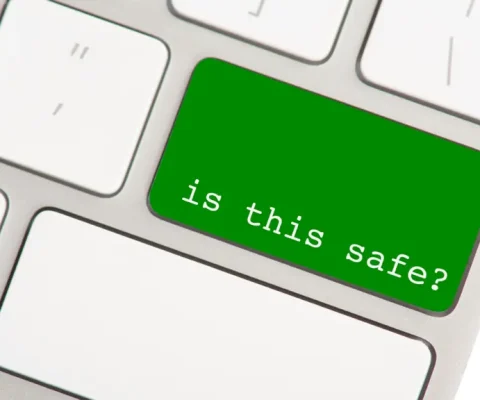 Bright Green Keyboard Key Labeled &Quot;Is This Safe?&Quot; Highlights The Importance Of Online Security And Cautious Digital Behavior.