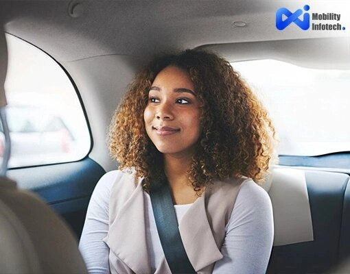 A happy female passenger riding safely in the back seat of a ride-hailing cab with a seatbelt on