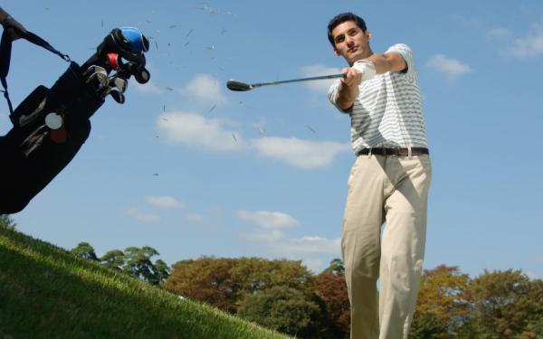 Golfer Taking A Practice Swing On A Golf Course, Highlighting The Importance Of Performance Tracking To Improve Consistency And Avoid Common Mistakes.
